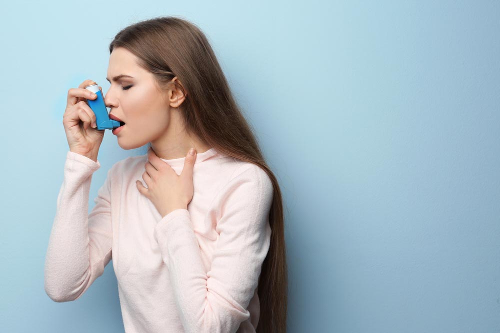 Woman with inhalator