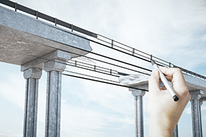 Man with pencil on a bridge