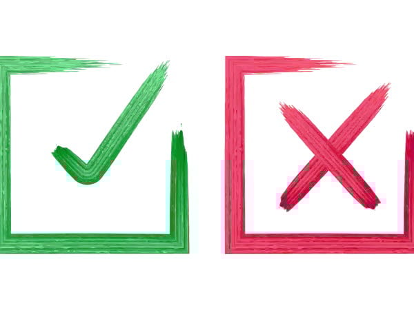 En grön ruta med en grön bock och en röd ruta med ett rött kryss